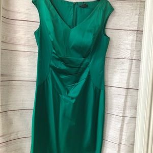 Emerald green satin dress.